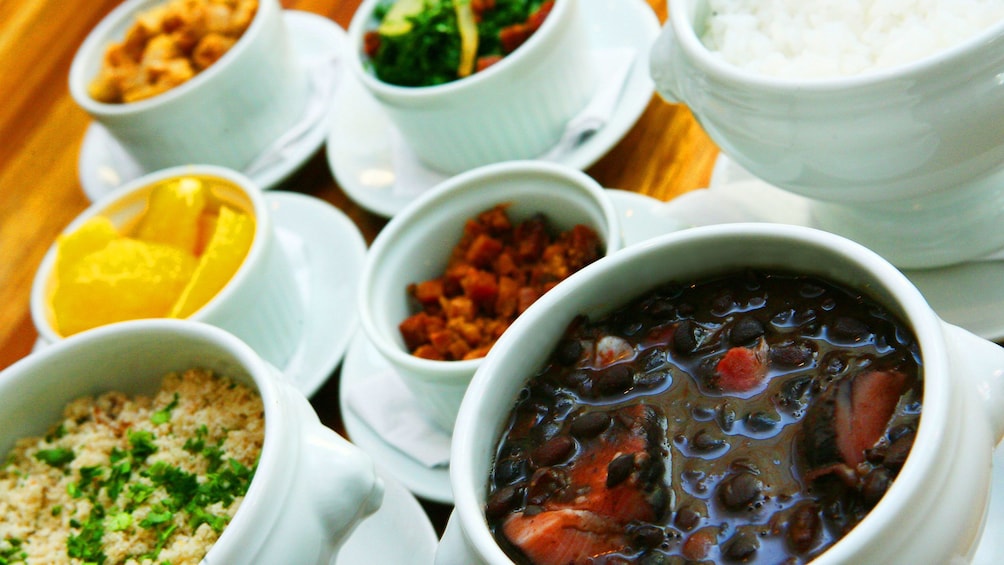 Bowls of Brazilian food on a table