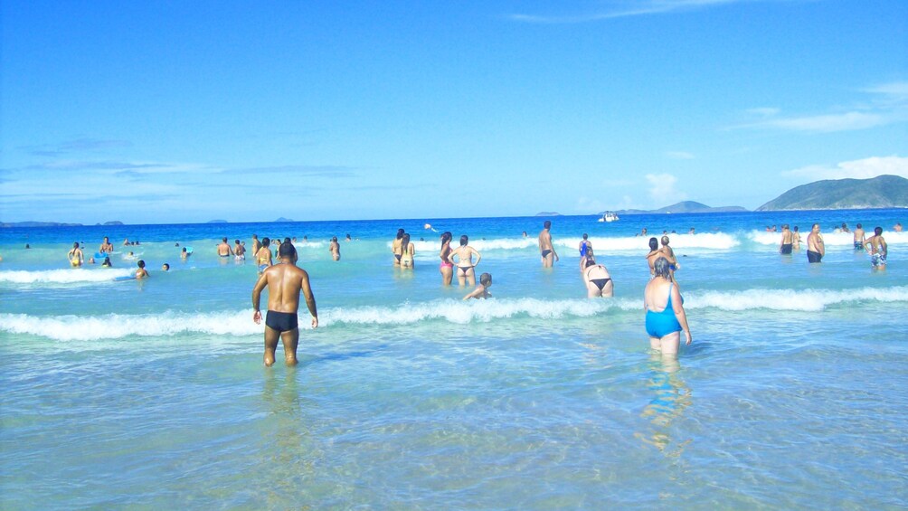 People in surf at Beach of Cabo Frio