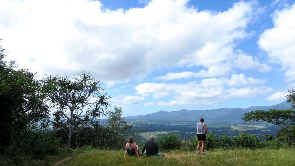 People taking a break while looking a the view on Nounou Mountain on Kauai