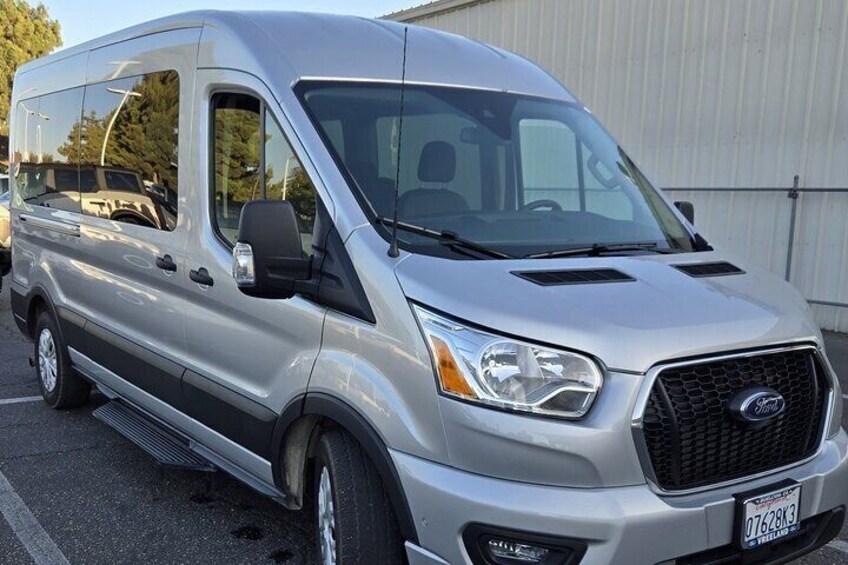 Ford Transit high top for six to ten persons . 