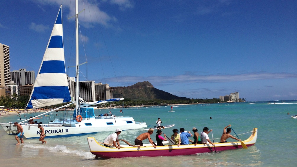 canoe heading out the the water in Oahu