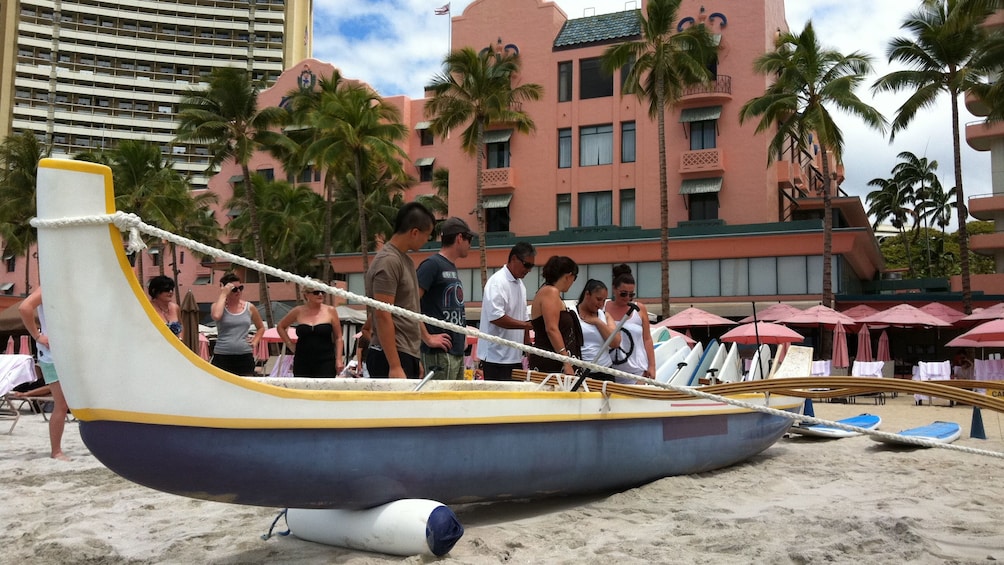 People getting ready to go in canoe in Oahu