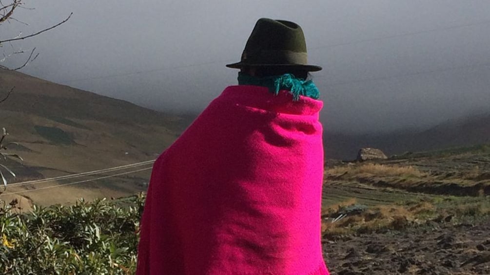 woman in black hat and pink blanket