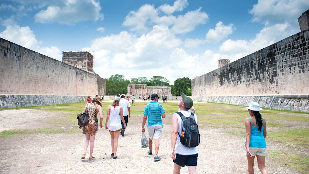 walking through the ancient structures in Chichen Itza