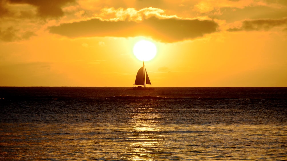 Sailboat at sunset in Oahu