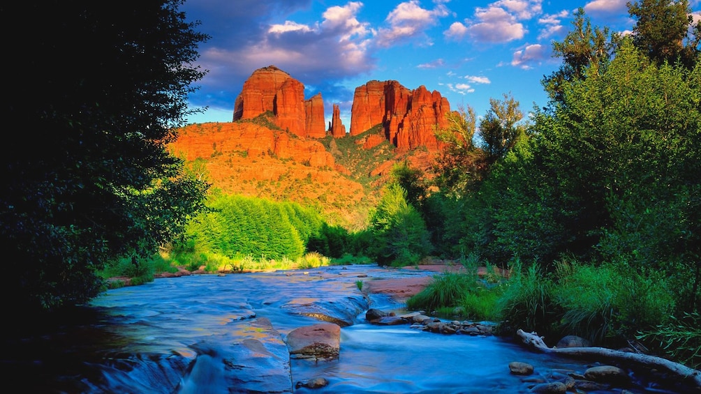 Beautiful landscape view of Grand Canyon during the day featuring flowing stream of water