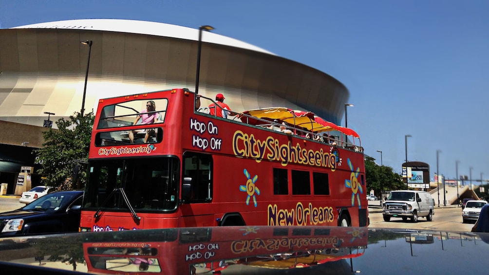 Hop-on hop-off bus outside a stadium in New Orleans