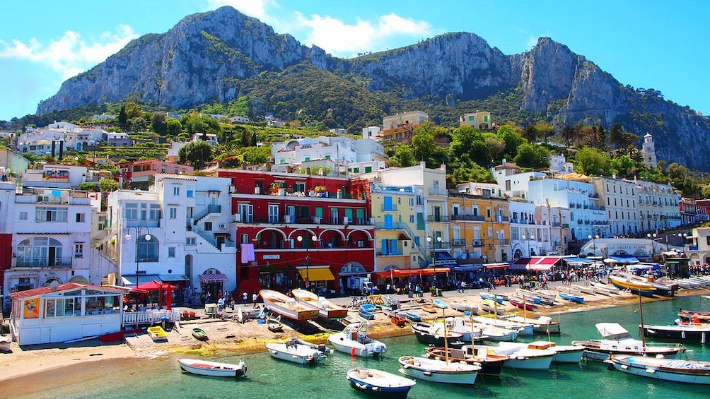 Boats clustered around beach of Capri Island