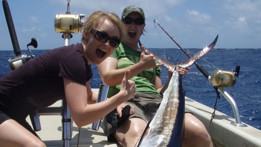 two excited women on fishing boat in Kauai