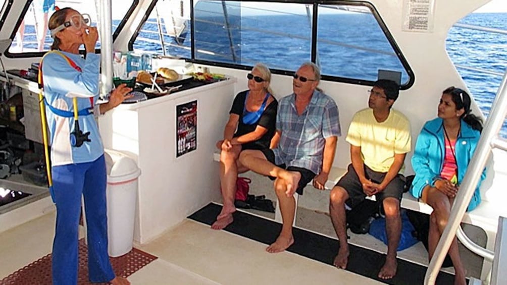 Snorkel instructor demonstrating on a boat in Maui