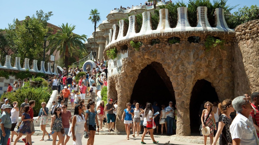 Tourists walk around Park Guell in Barcelona