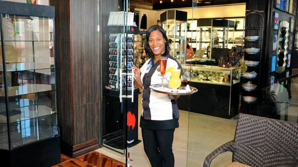 airport lounge staff serving drinks in Nassau