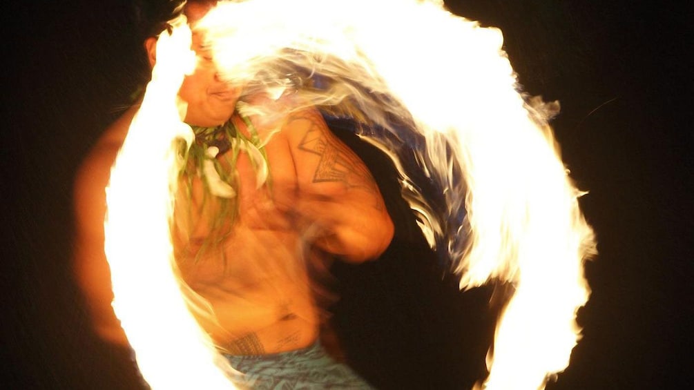 Luau performer with fire in Honolulu
