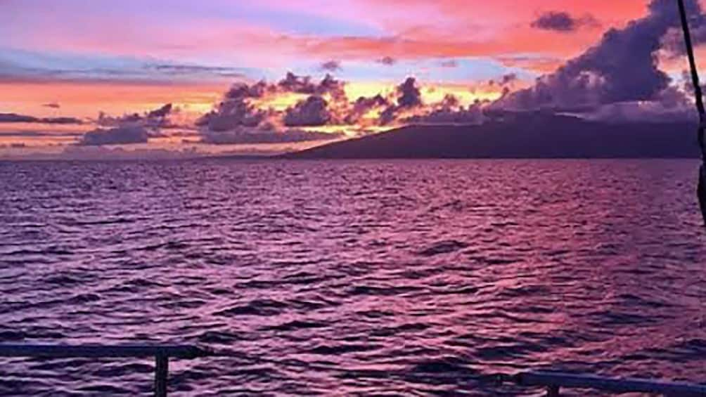 admiring the sunset from a sailboat in Maui