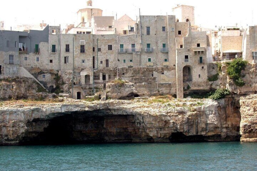 Grotta Dell'Arcivescovado and historic center overlooking the sea