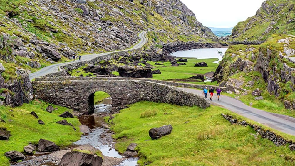 hikers on a narrow road in Ireland