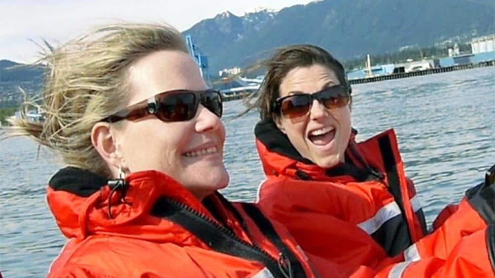 Two ladies enjoying the whale watching tour in Vancouver BC 