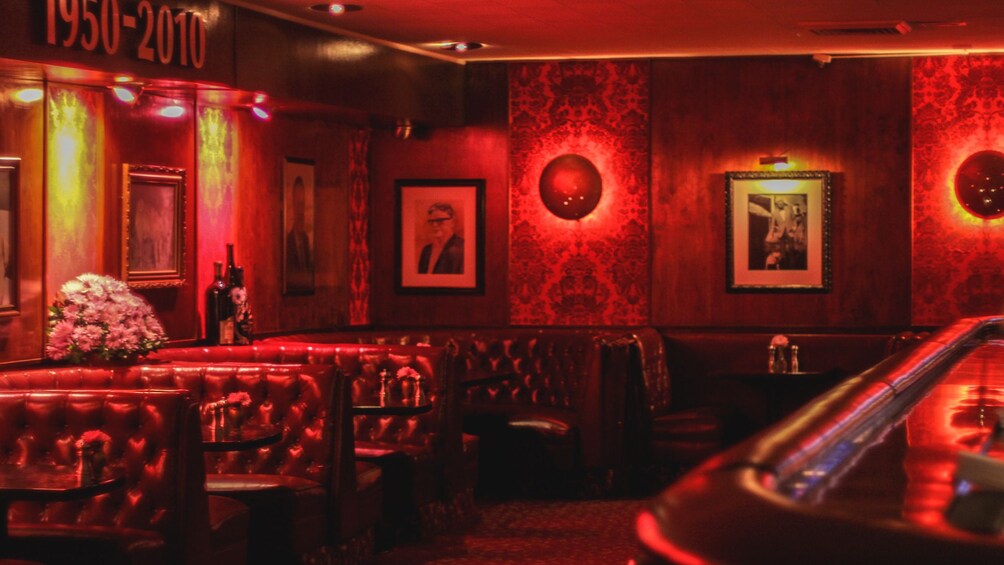 Interior view of local pub with red ambiance.