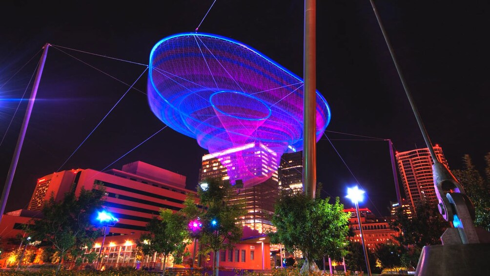 Civic Space Park illuminated at night.