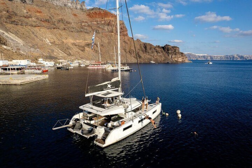Half-Day Exclusive Catamaran Cruise in Santorini with Meal and Open Bar