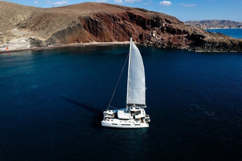 Half-Day Exclusive Catamaran Cruise in Santorini with Meal and Open Bar