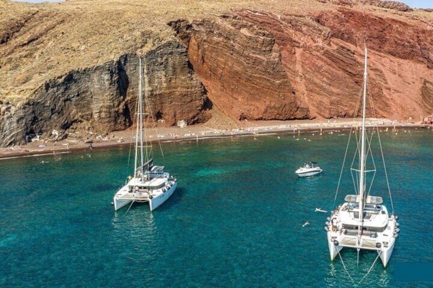 Half-Day Exclusive Catamaran Cruise in Santorini with Meal and Open Bar