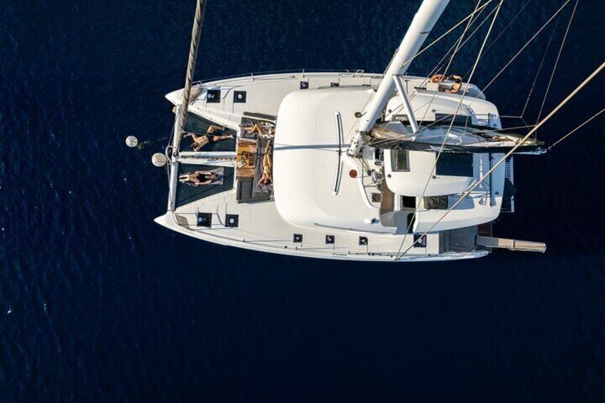 Half-Day Exclusive Catamaran Cruise in Santorini with Meal and Open Bar