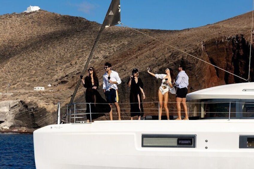 Half-Day Exclusive Catamaran Cruise in Santorini with Meal and Open Bar