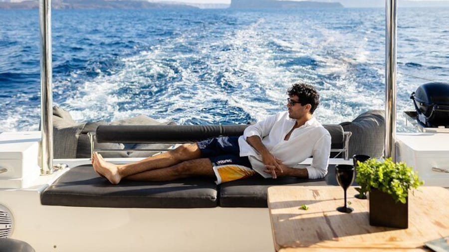 Half-Day Exclusive Catamaran Cruise in Santorini with Meal and Open Bar