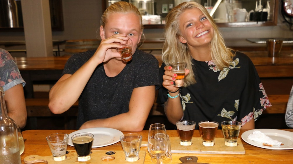 Show item 4 of 10. Couple tasting beer in Sydney