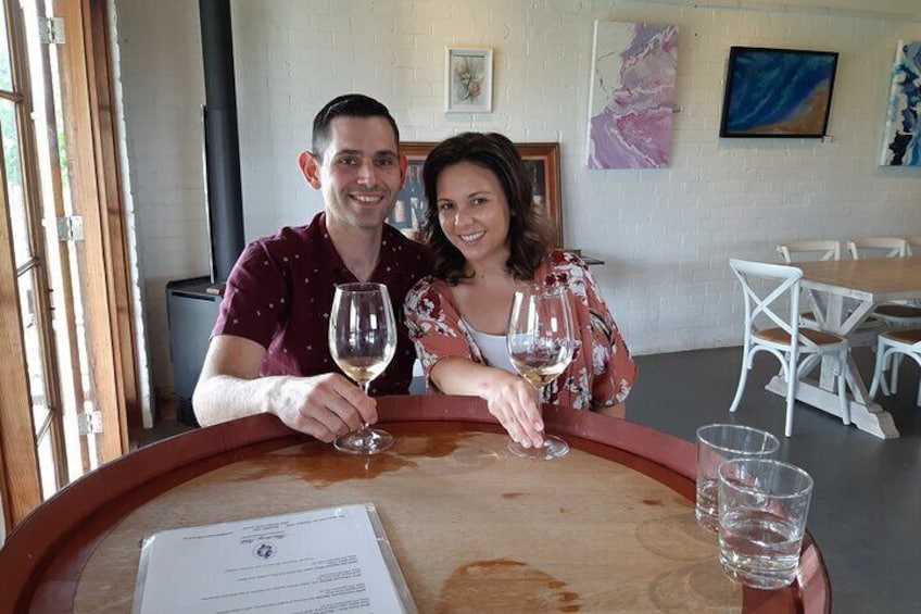 A couple enjoying a tasting at Blueberry Hill Estate