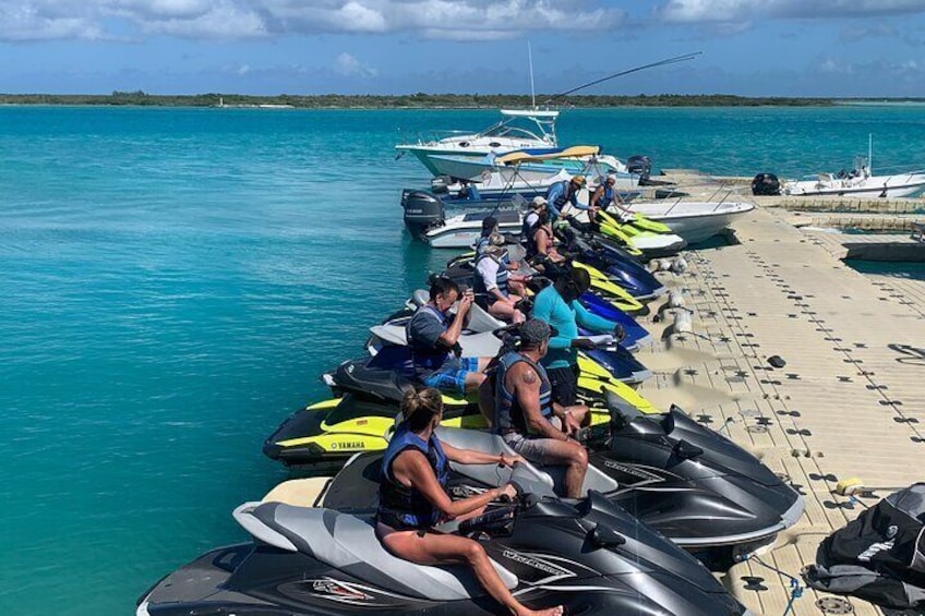 Jet Skiing around La famille ship and smaller pristine cays