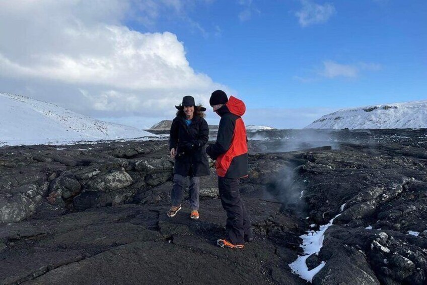 A family over the lava field at Fagradalsfjall Volcano.