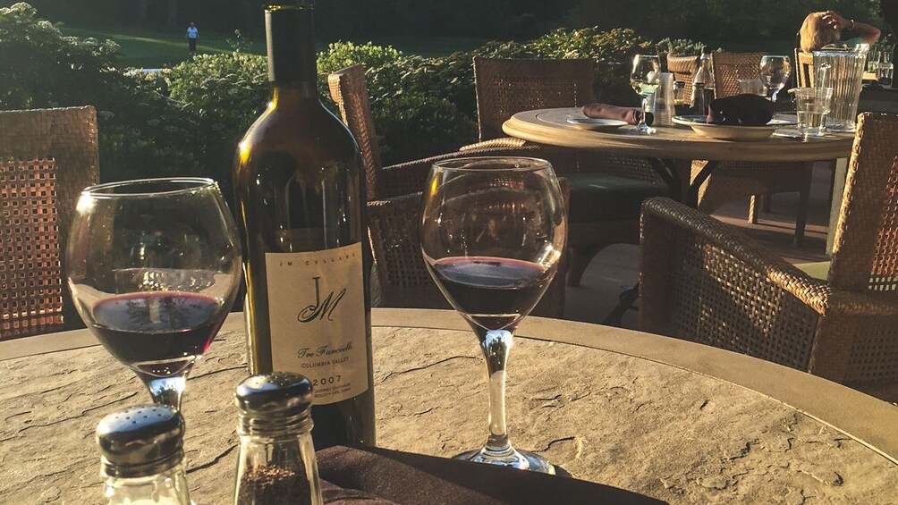 Several tables prepared for wine tasting on outside patio.