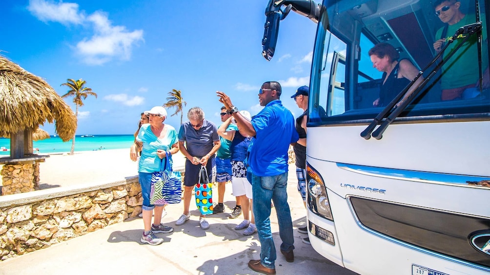 Tourists getting off of the bus in Aruba 