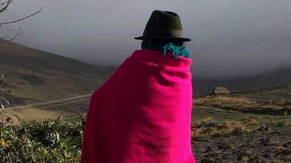 village woman looking out into the misty climate in Quito