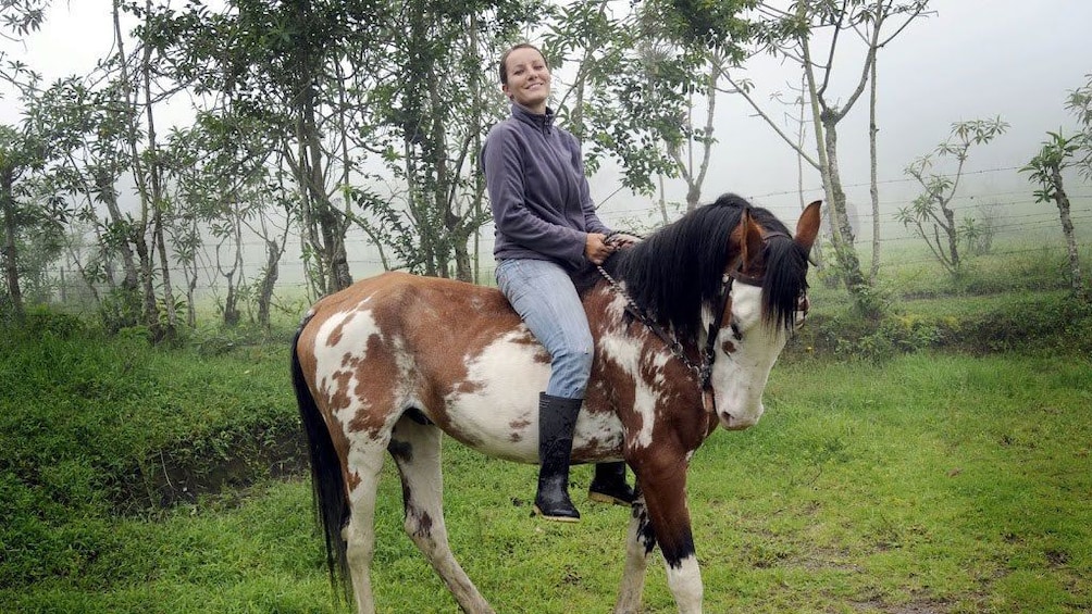 Woman on horseback in Quito