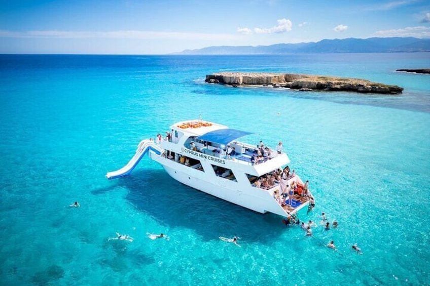 Blue Lagoon (Akamas) Bus & Boat Tour with Water Slide from Paphos