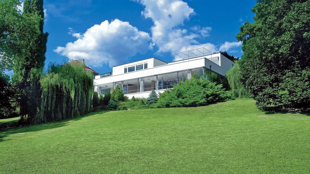 a modern villa on top of a hill
