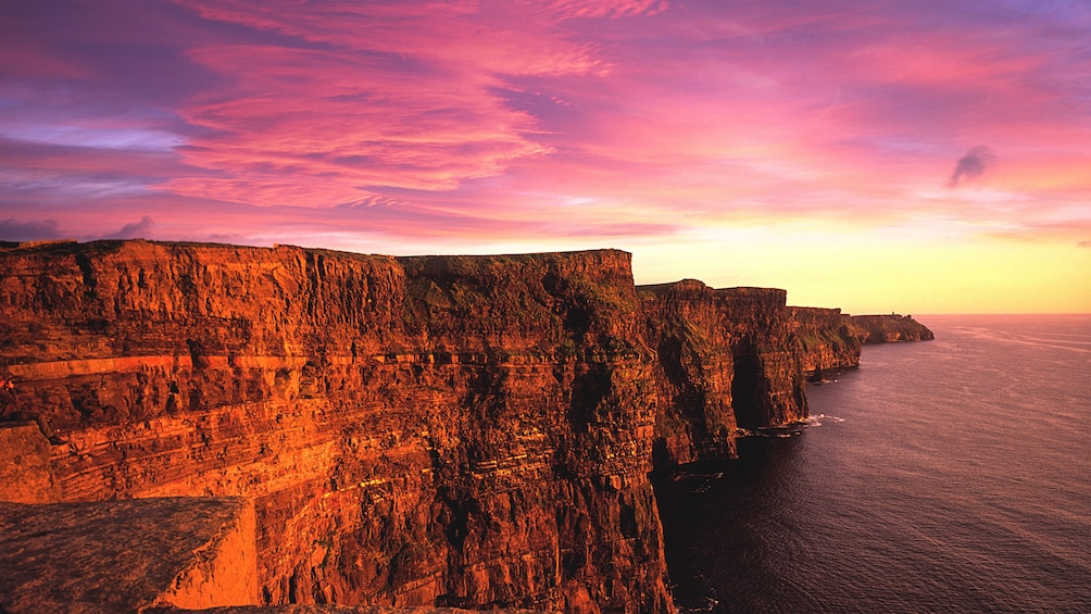 Vibrant sunset view of Cliffs of Moher.