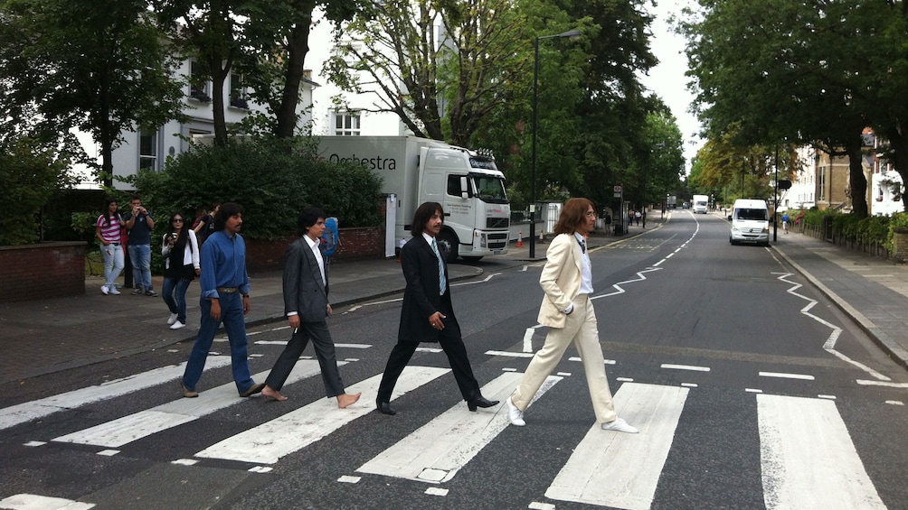 Group recreating iconic cover to the Beatles Abbey Road album