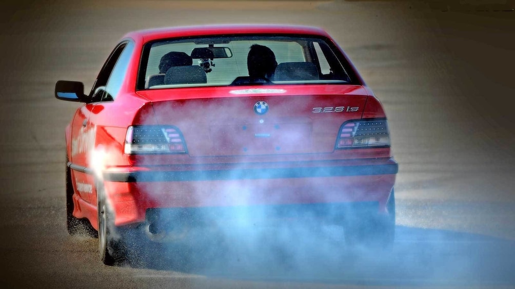 Show item 3 of 5. stunt car kicking up smoke and dust in Ontario