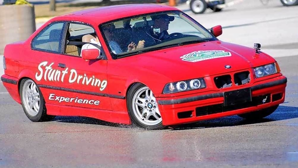 Show item 1 of 5. red stunt car drifting on the wet tracks in Ontario