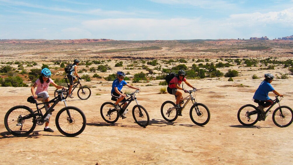 group riding bikes in the bright sun in Green River