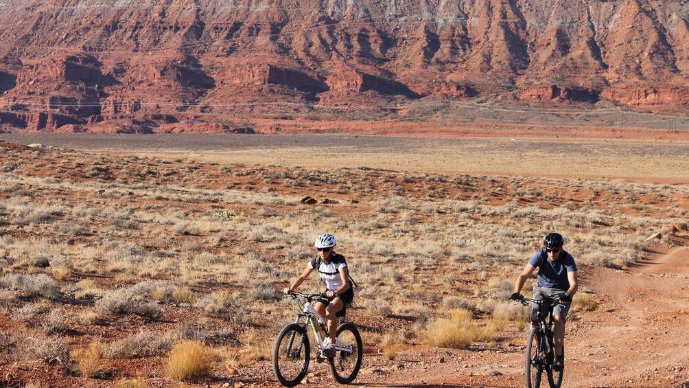 riding bikes along a dry dessert trail in Green River