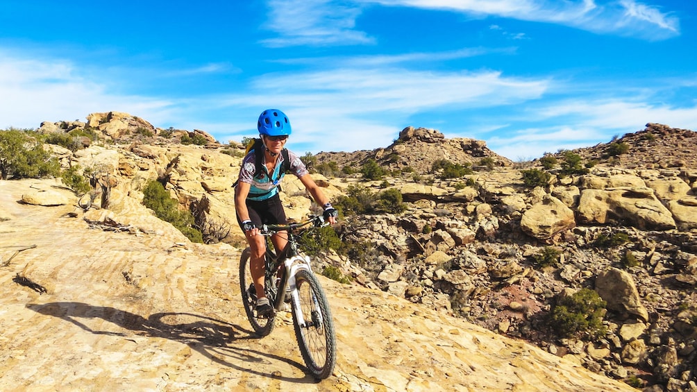 Woman descending down bike trail in North Klondike.