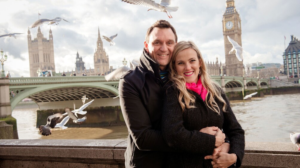 Show item 1 of 5. Couple on the banks of the thames river in London