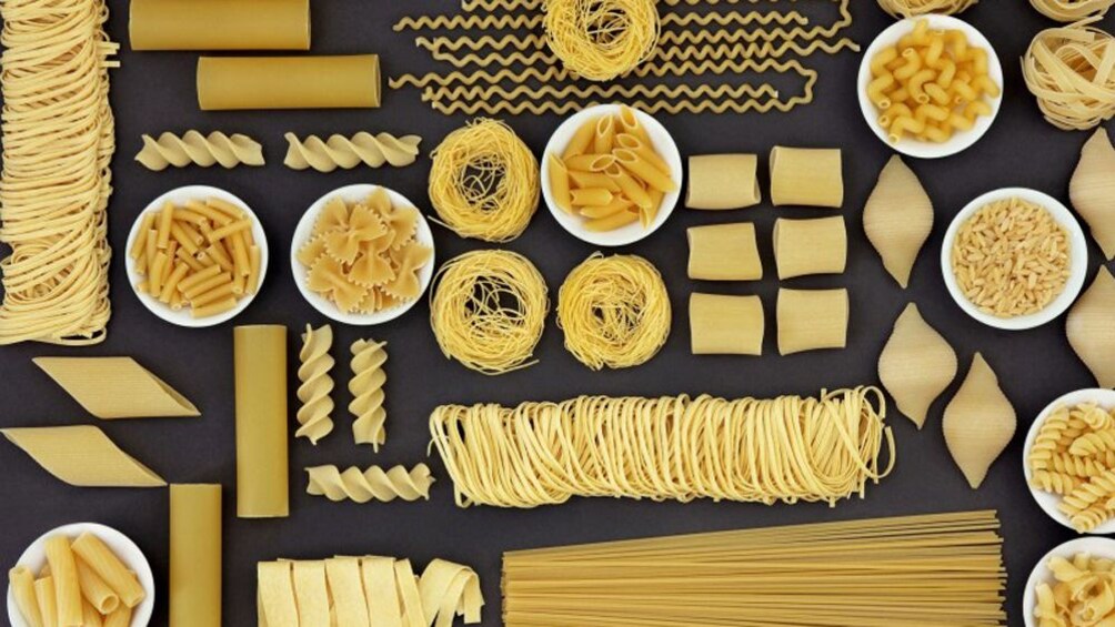 Charger l’élément 4 sur 5. Multiple types of pasta arranged in an artistic display