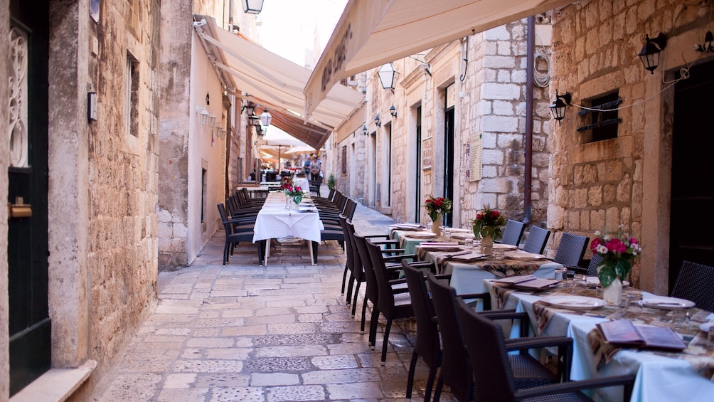 Show item 5 of 8. Tables set in an alley in Dubrovnik