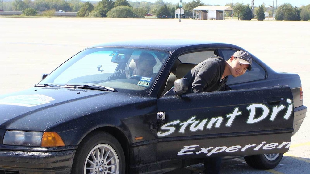 Show item 3 of 5. stunt driver getting out of the car in Ontario